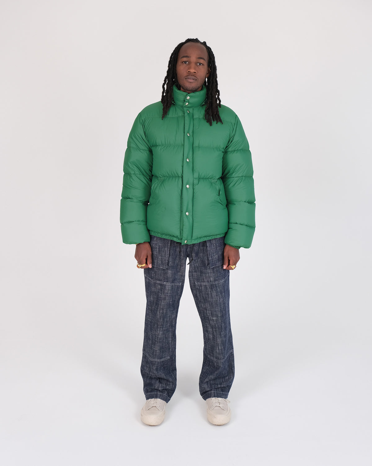Model wearing the Crescent Down Works &quot;Green&quot; colorway of the Down Sweater. 