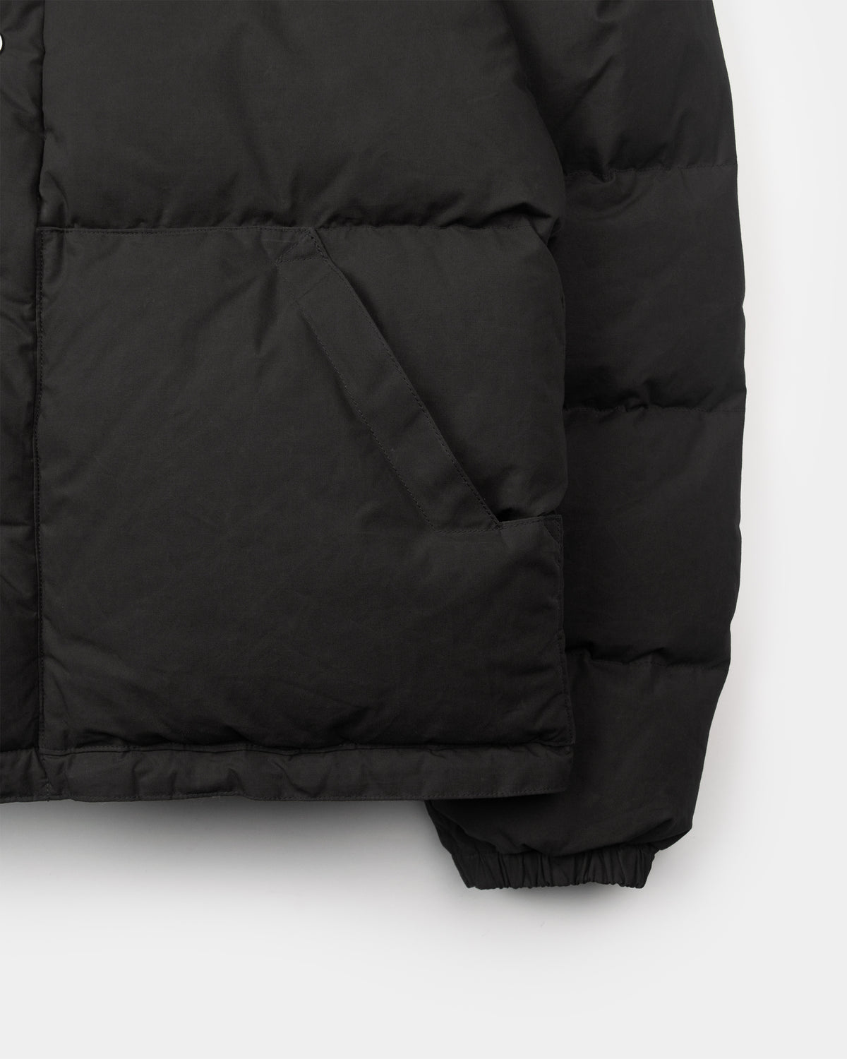 Black down sweater jacket with quilted panels front pocket made of dry wax cotton for cold weather use