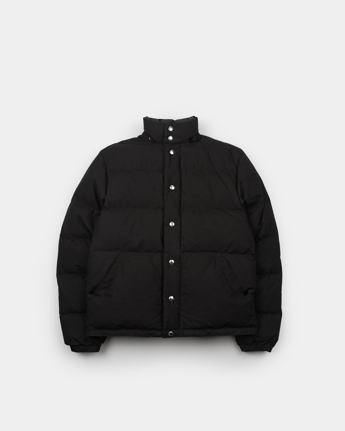 Down sweater black puffer jacket with high collar silver buttons made from dry wax cotton for cold weather