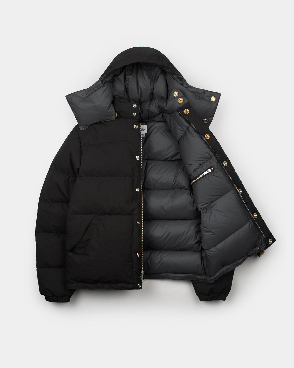 Black down sweater puffer jacket with hood leather snap reinforcement quilted dry wax cotton design