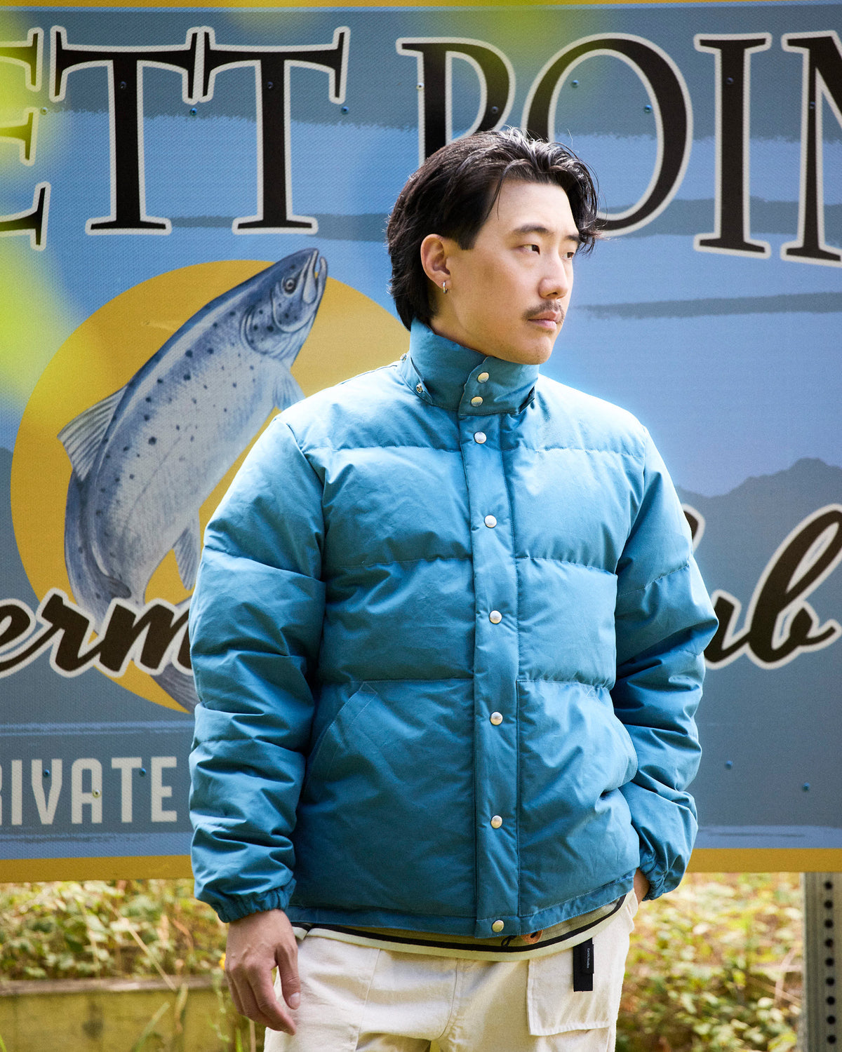Robin's Blue down sweater jacket in dry wax cotton with high collar and button closures 