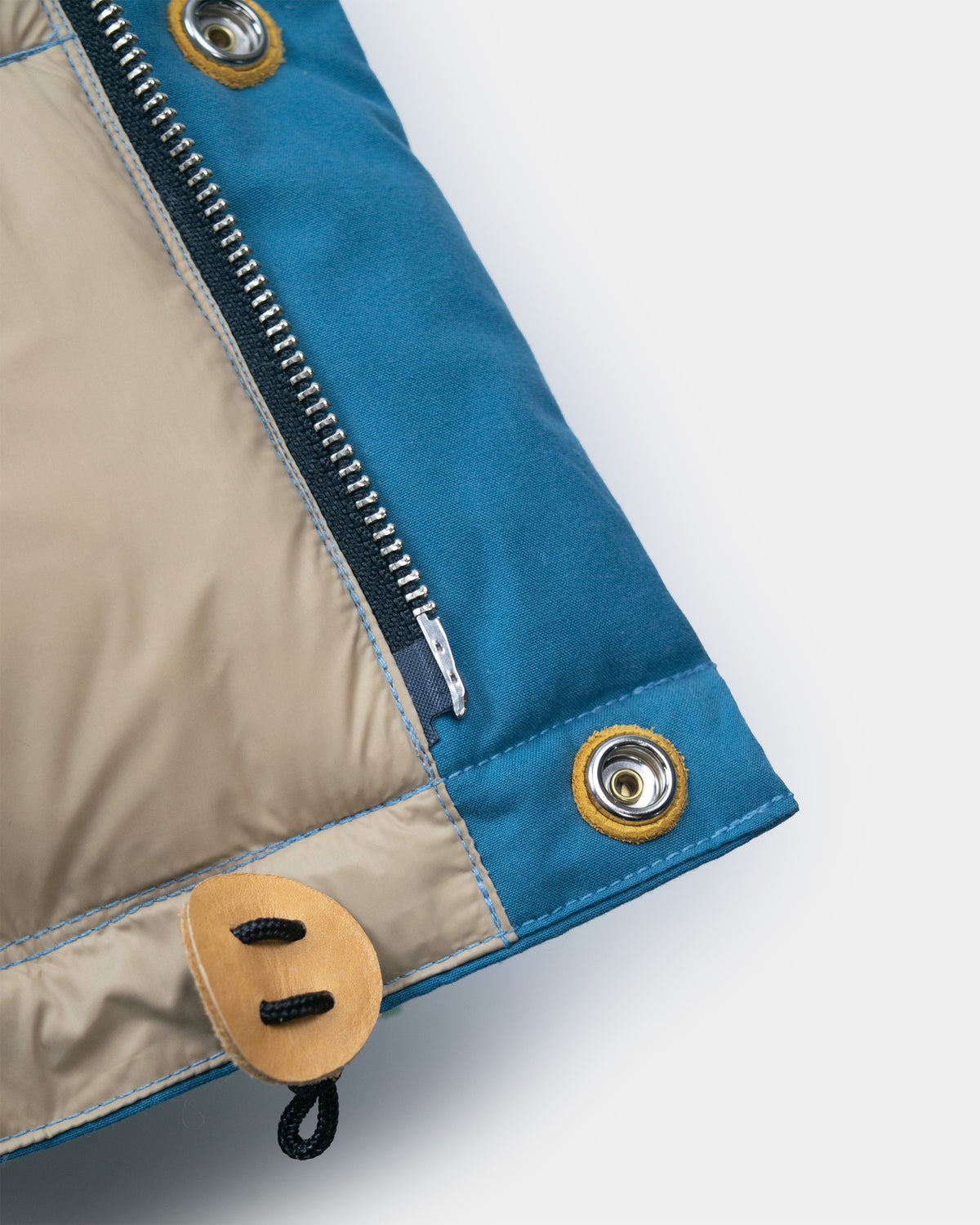 Robin's Blue down sweater puffer jacket with zipper metal grommets and leather toggle made of dry wax cotton
