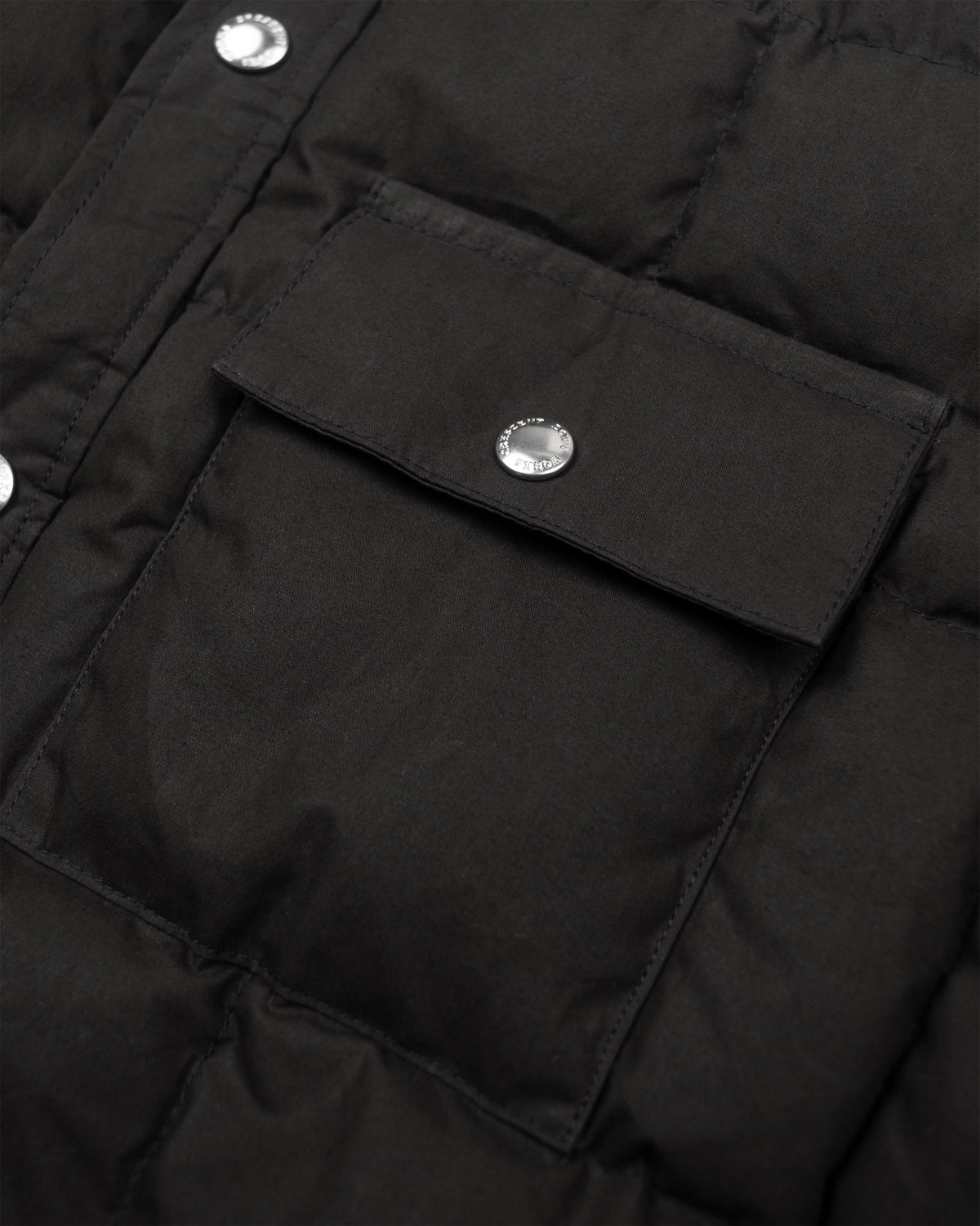 Black down shirt puffer jacket in dry wax cotton with quilted stitching and silver toned button closures