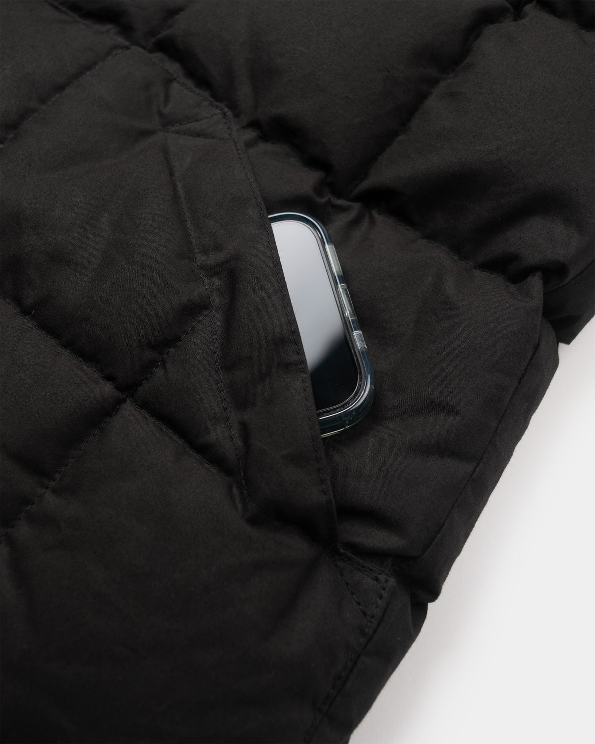 Black quilted puffer vest down shirt with dry wax cotton fabric featuring a phone in the front pocket