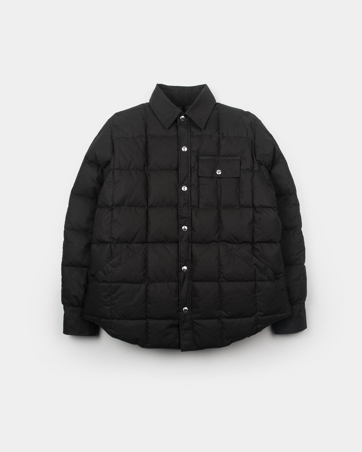 Black quilted puffer down shirt with button-down front and chest pocket made from dry wax cotton