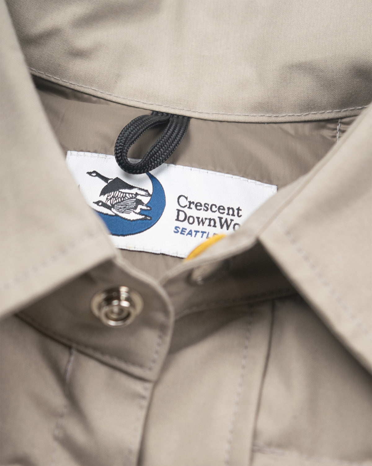 Stone quilted down shirt in dry wax cotton with crescent downwear seattle label featuring blue moon and geese