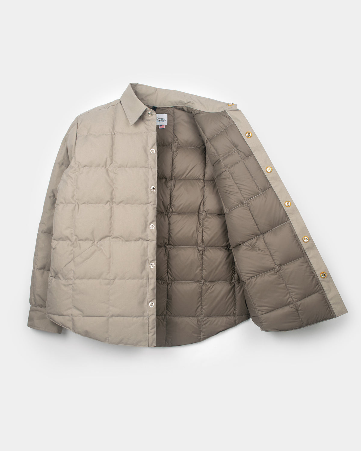 Stone quilted down shirt puffer jacket in dry wax cotton with darker lining and gold-tone buttons stone color