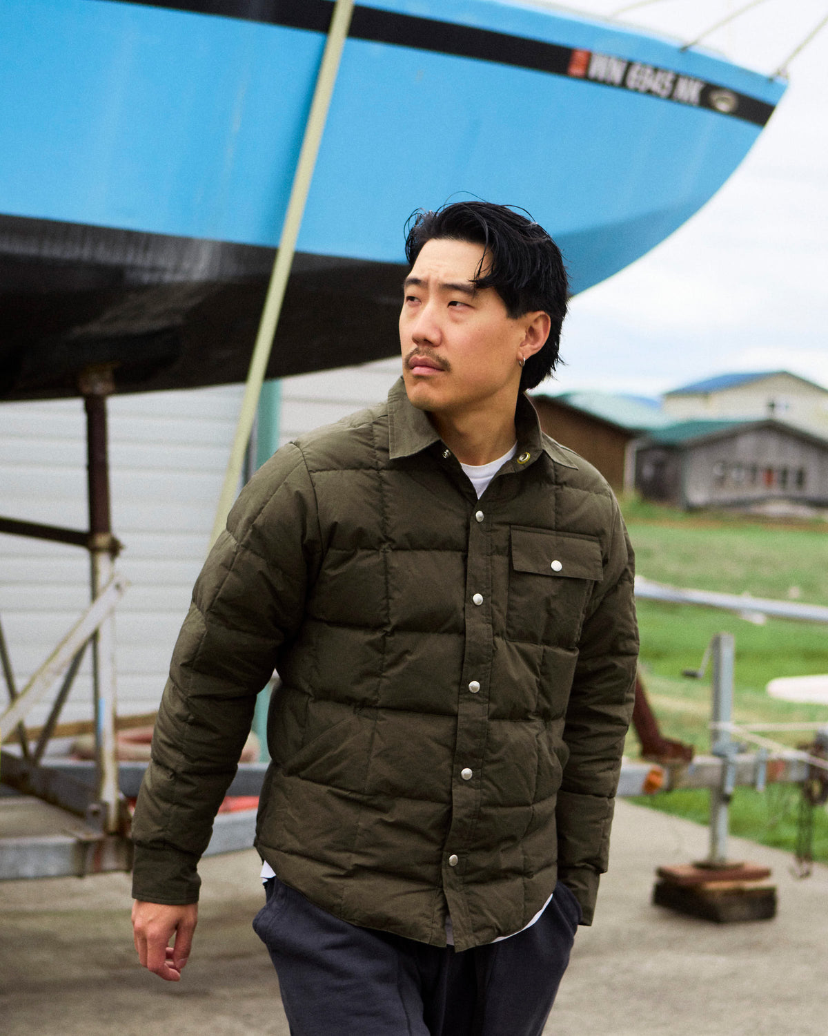 Olive green quilted puffer jacket down shirt made of dry wax cotton for durable outdoor use