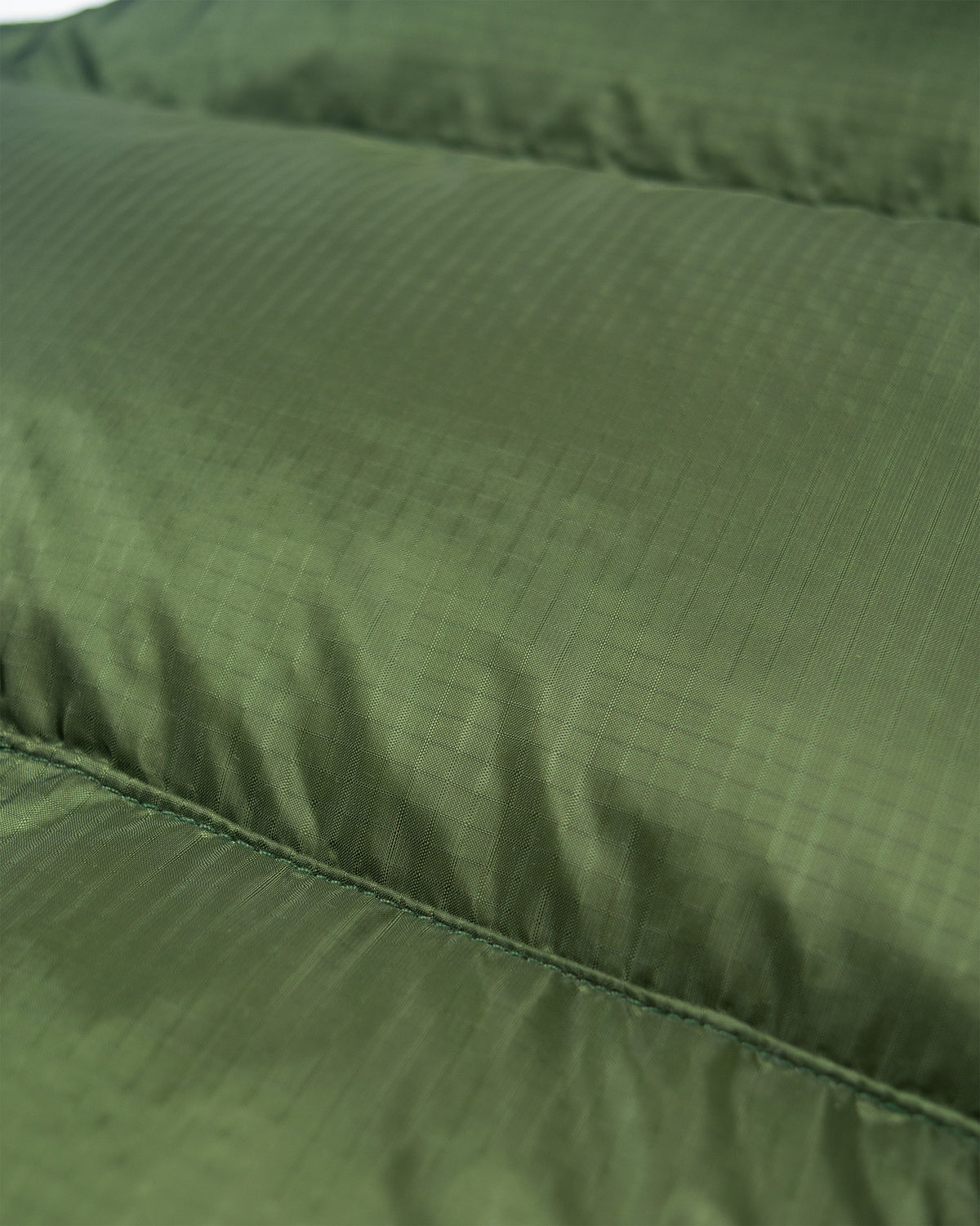 Olive green down italian vest made of ripstop nylon with quilted fabric and visible stitching along the seams