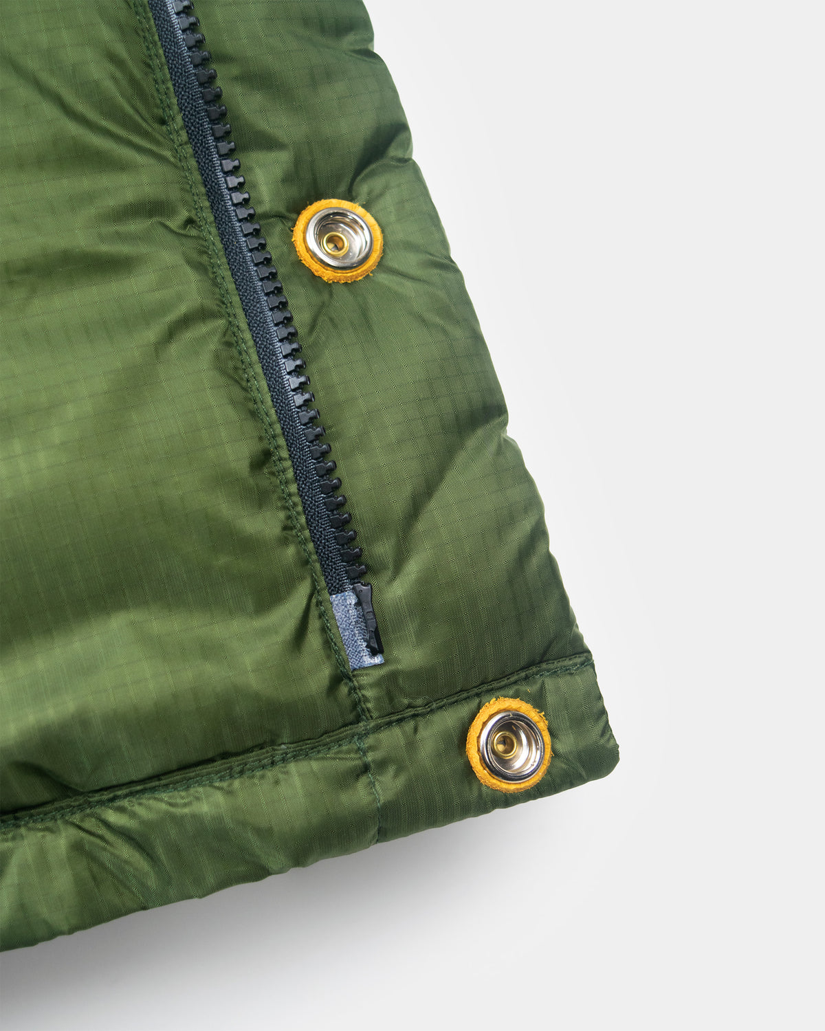 Olive green down italian vest in ripstop nylon with black zipper and leather snap reinforcement