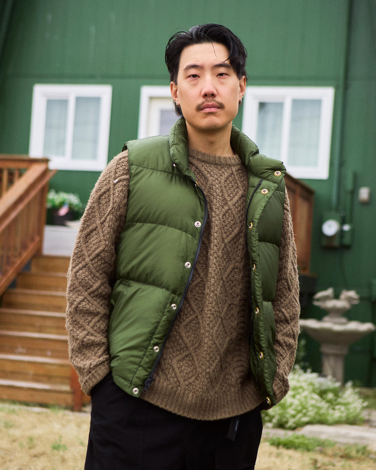 Olive green quilted down italian vest with silver-toned snap buttons made of ripstop nylon