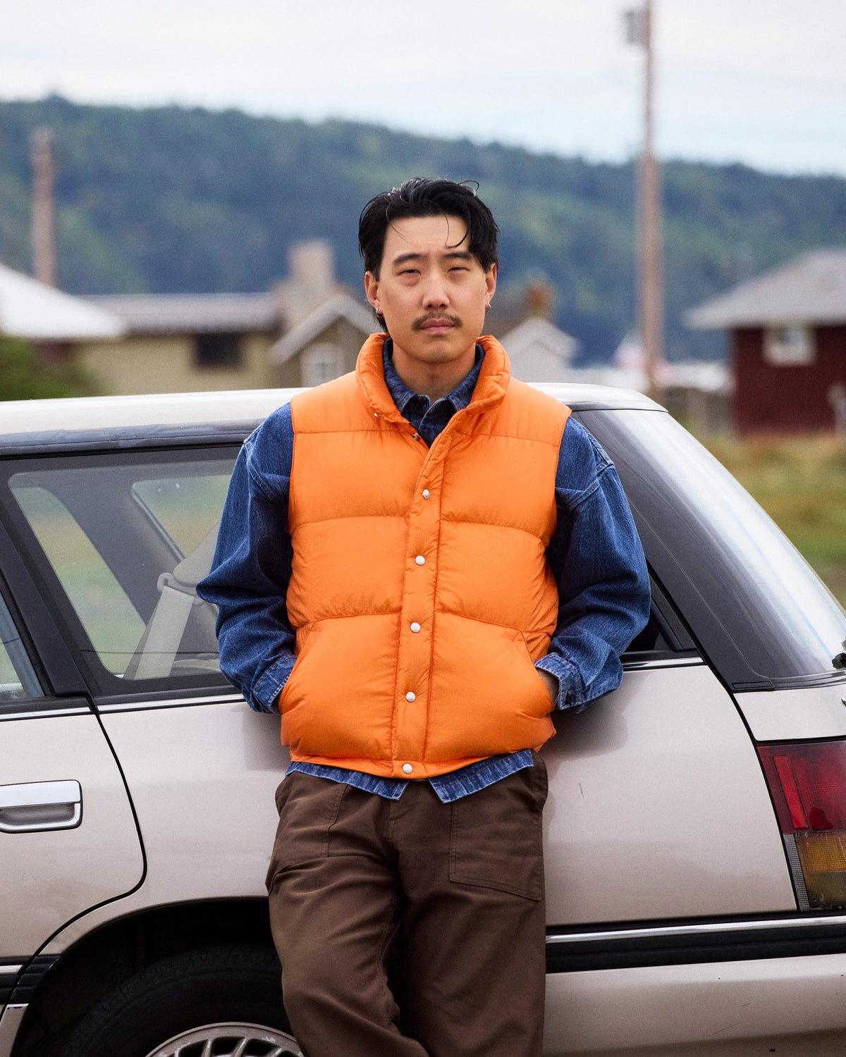 Orange quilted down italian vest made of ripstop nylon designed for lightweight warmth and durability