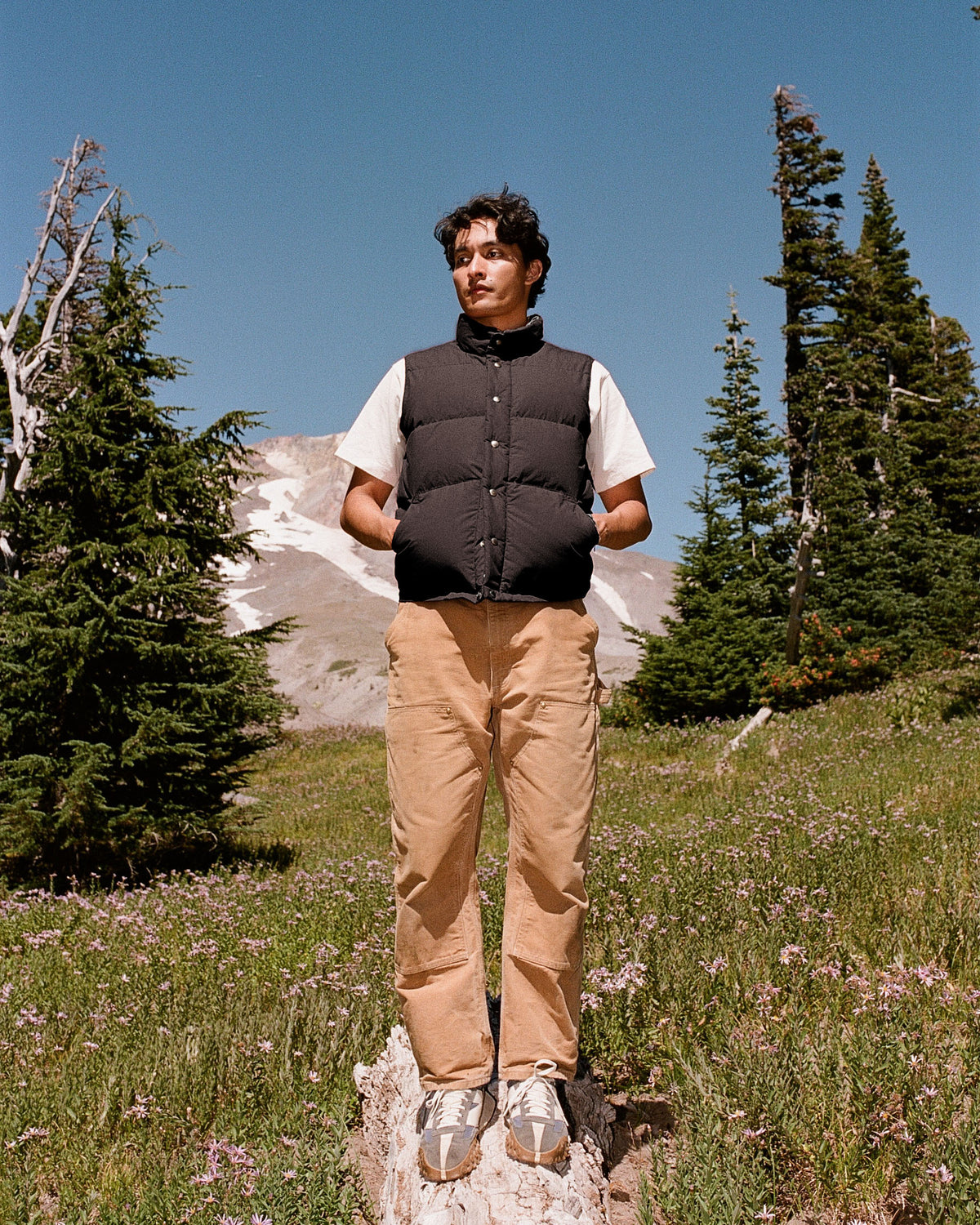 Black quilted down italian vest made from dry wax cotton for warmth and style