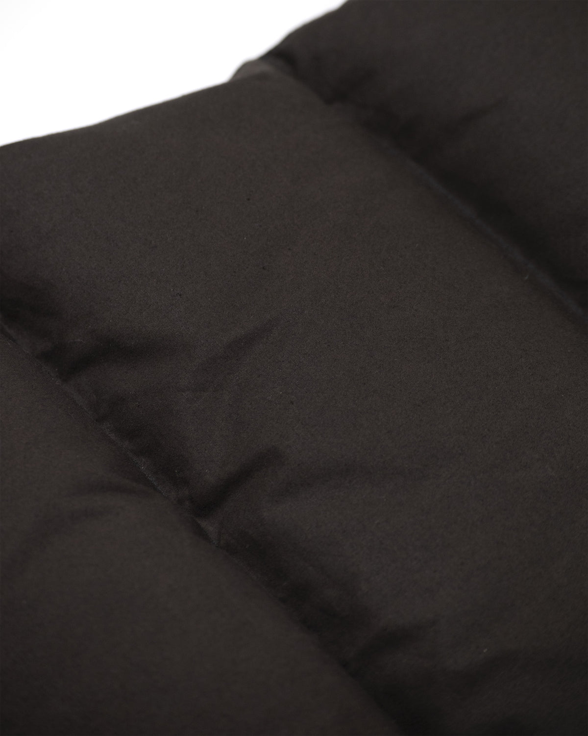 Black down italian vest in dry wax cotton with quilted stitching and smooth insulated fabric