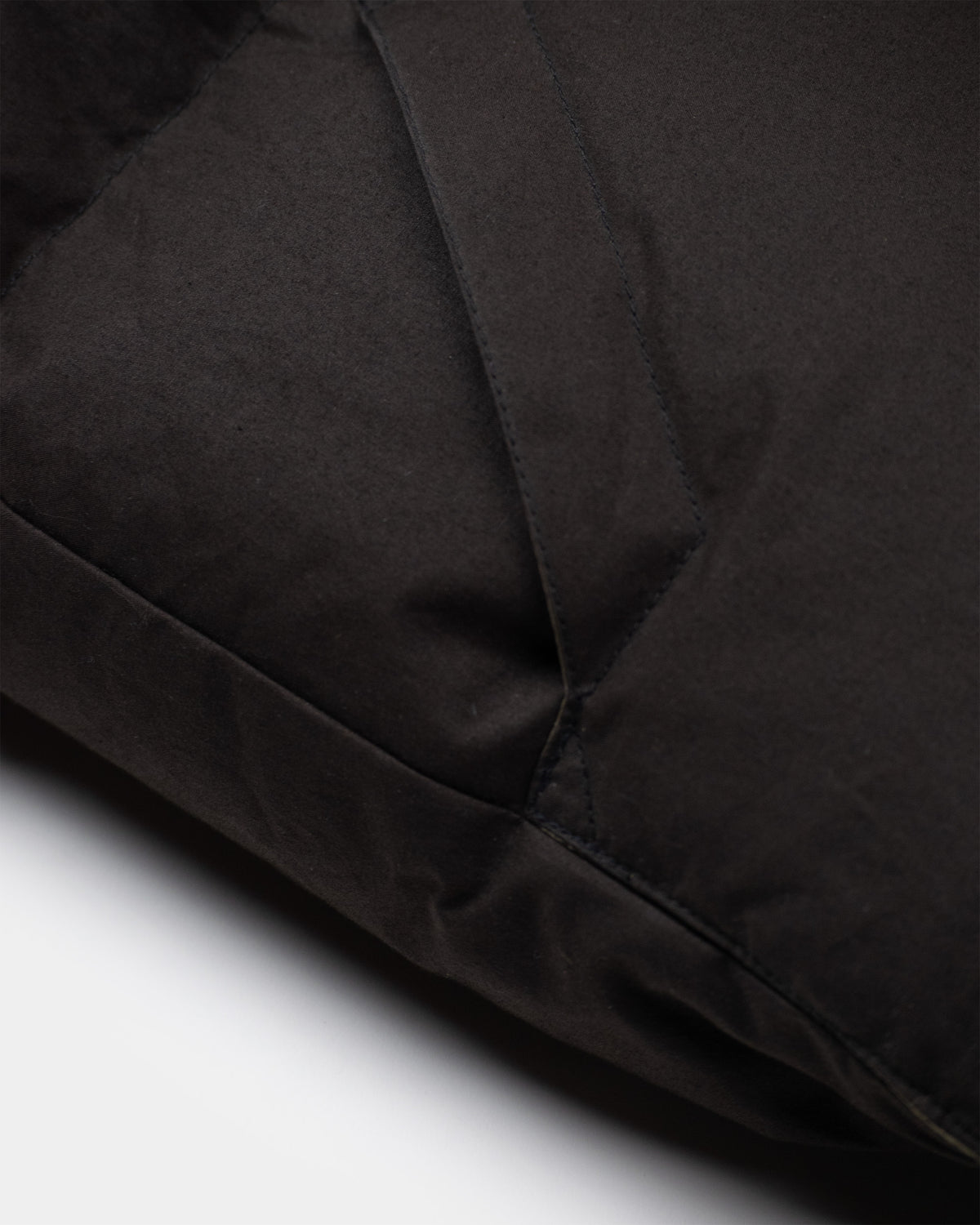 Black quilted puffer jacket down italian vest with smooth dry wax cotton fabric and visible stitching seams