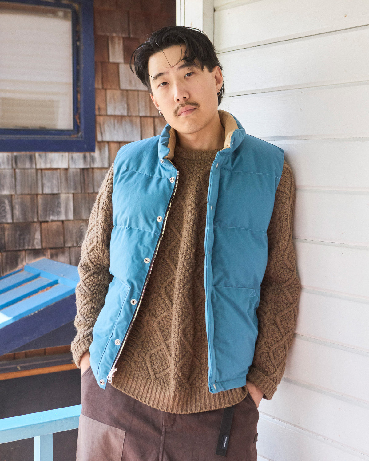 Blue quilted down italian vest with tan collar and front zipper made from dry wax cotton 