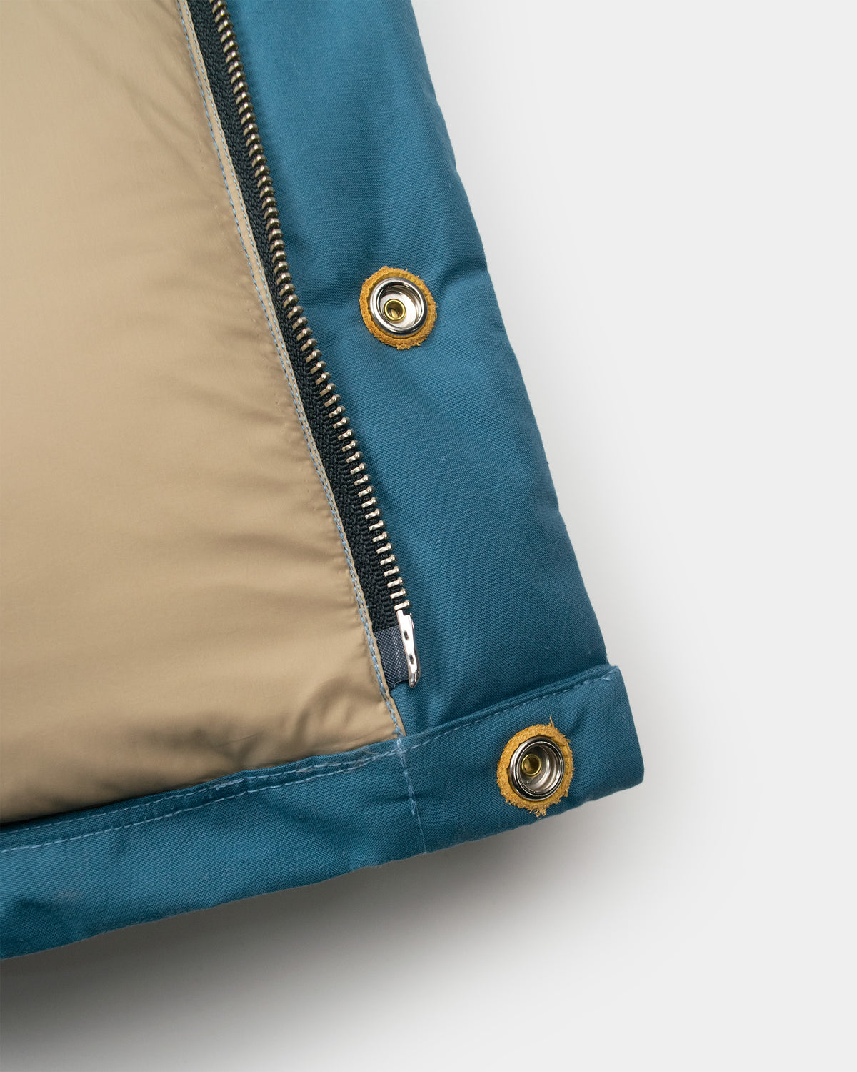 Down italian vest in robin's blue dry wax cotton with nylon exterior beige interior and leather snap reinforcements