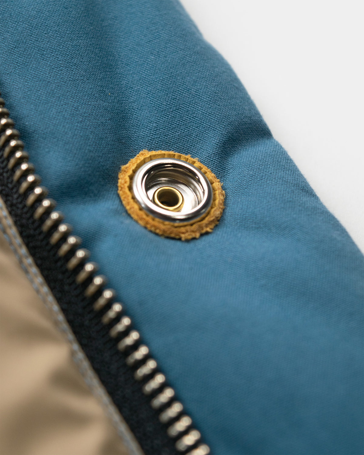 Robin's blue down italian vest in dry wax cotton with silver metal grommet and leather snap reinforcement