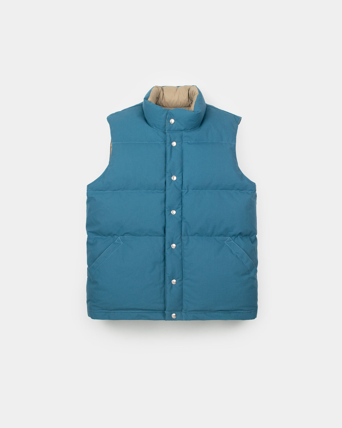 Teal quilted down italian vest with beige-lined collar and front button closure made from dry wax cotton 