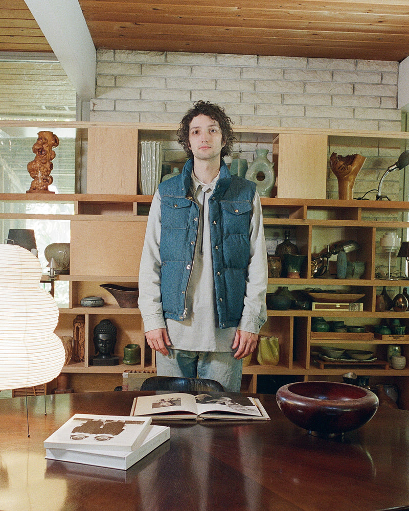 2000 Male Model standing in room wearing Italian Vest in Denim