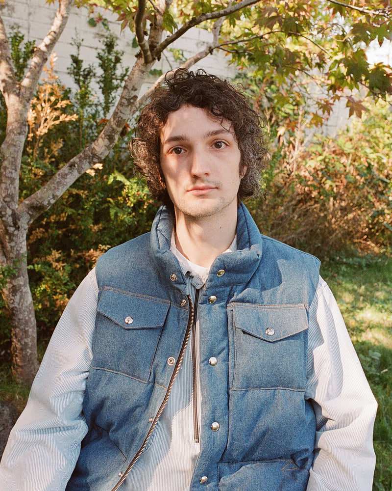 2000 Male Model Wearing Denim Italian Vest outdoors closeup