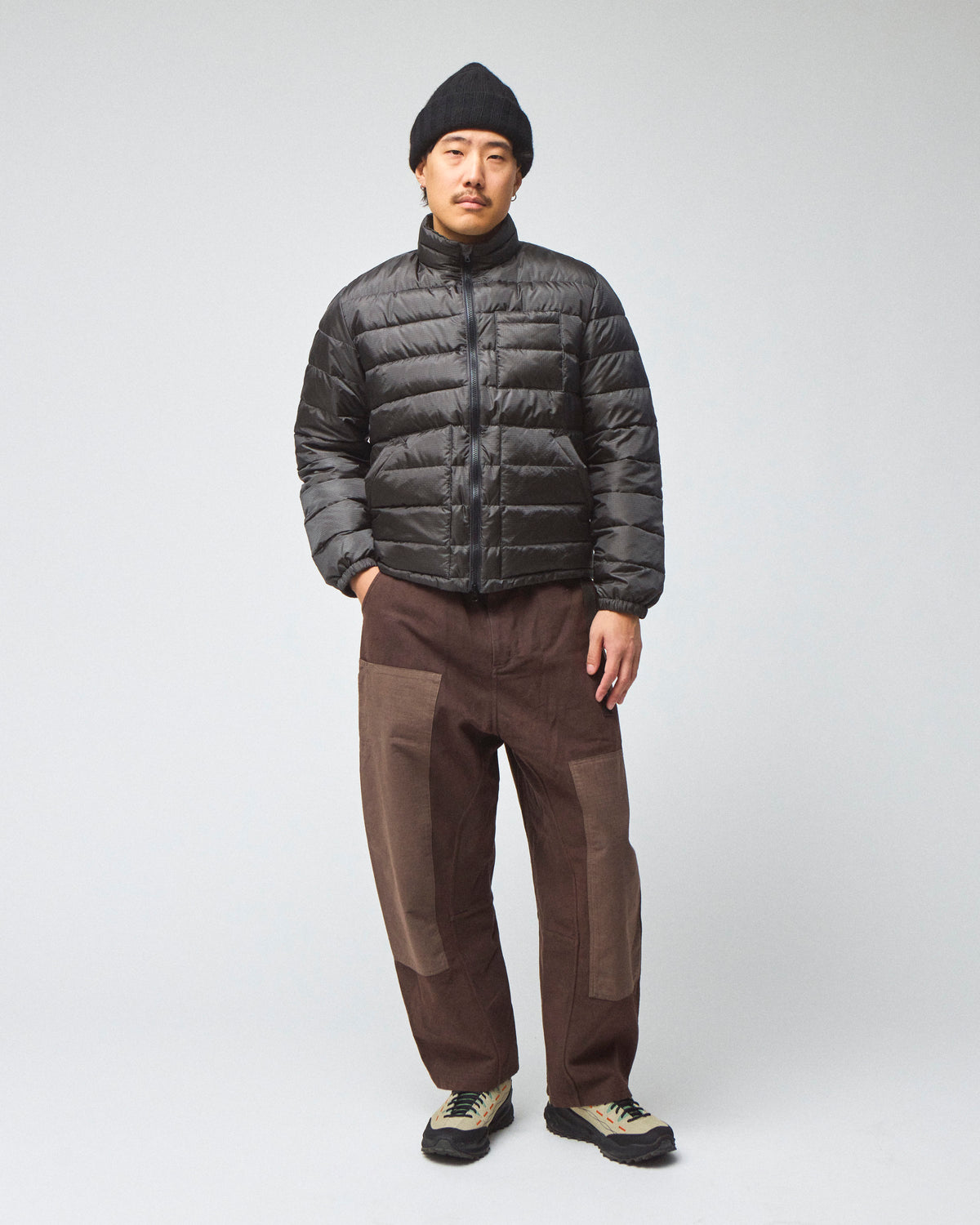 Model wearing a Seattle Jacket in Charcoal, worn zipped