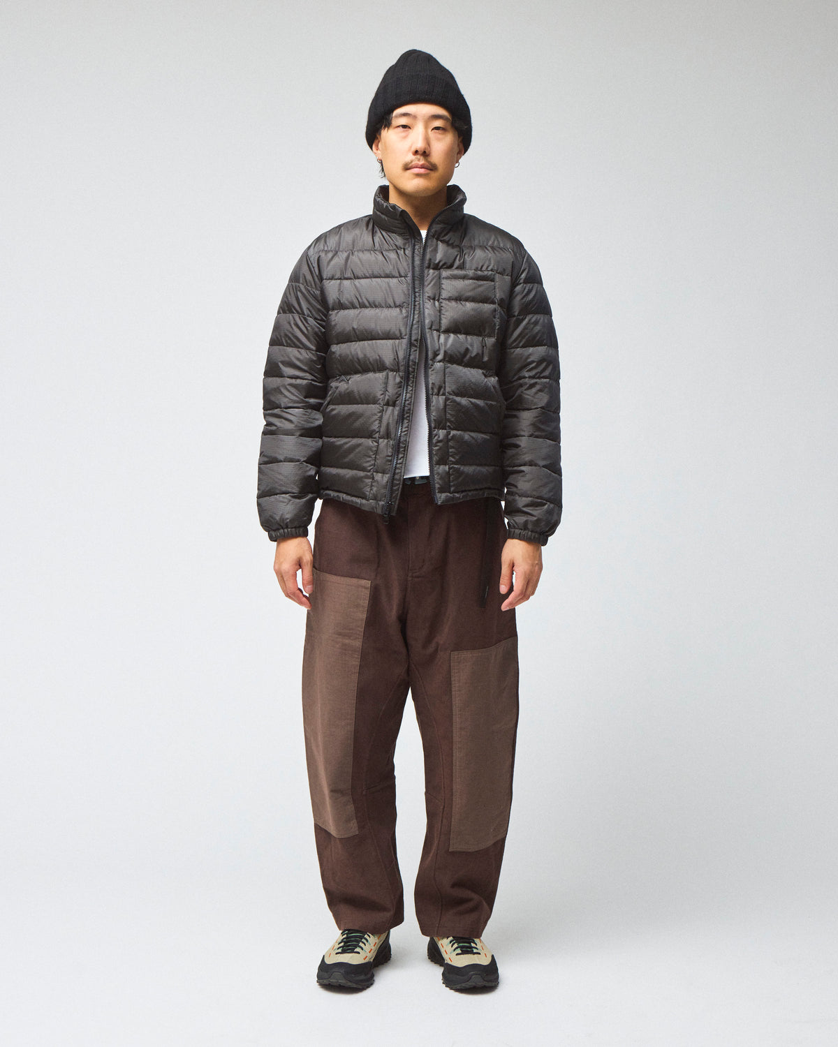 Model wearing a Seattle Jacket in Charcoal, worn unzipped