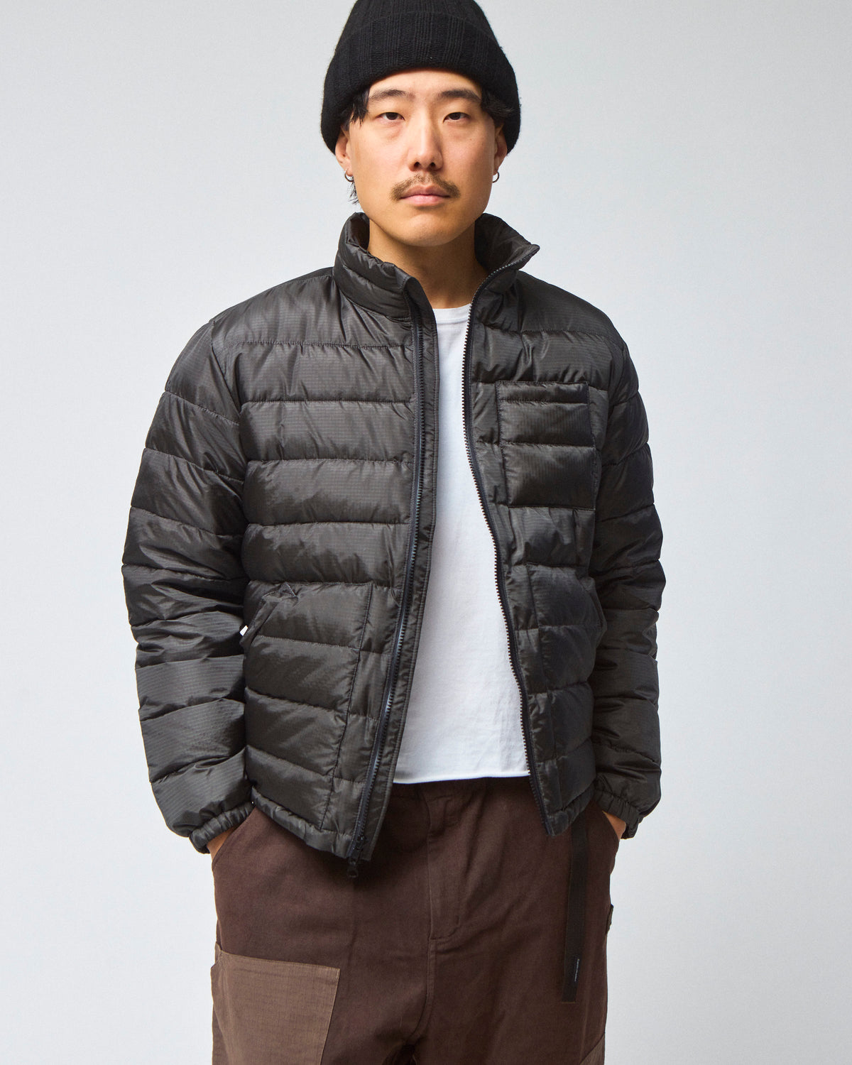 Model wearing a Seattle Jacket in Charcoal, worn unzipped