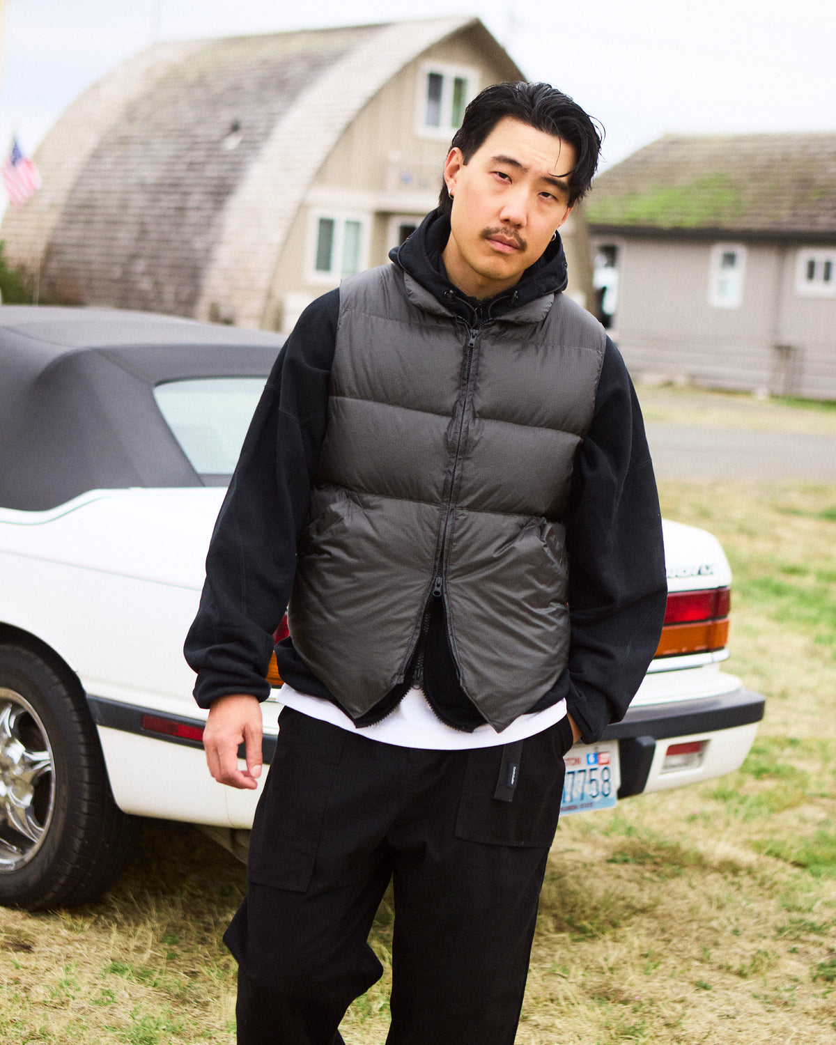 Charcoal puffer vest with quilted design and zipper closure in ripstop nylon from north by northwest