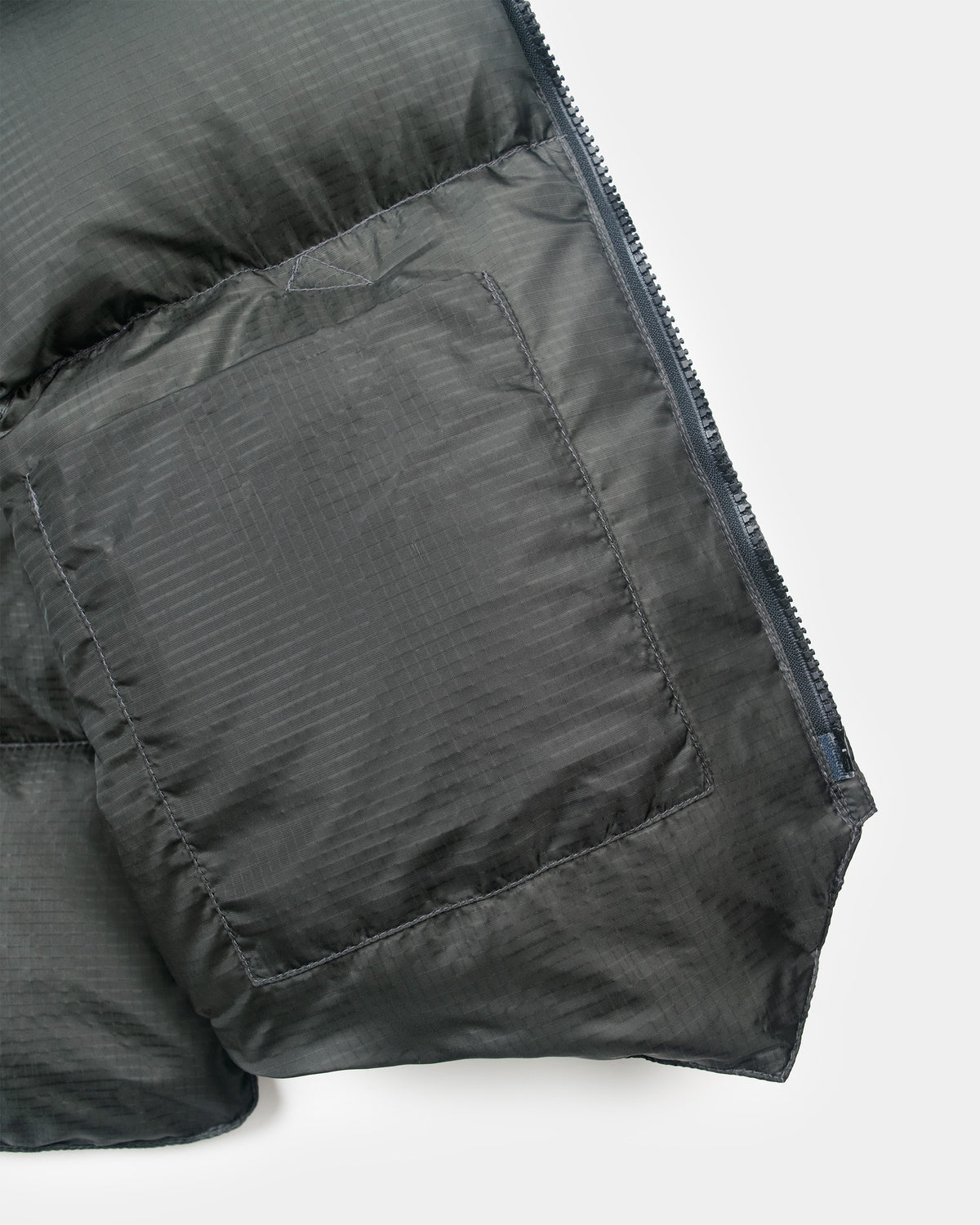 Charcoal north by northwest ripstop nylon puffer vest with quilted texture and pocket 