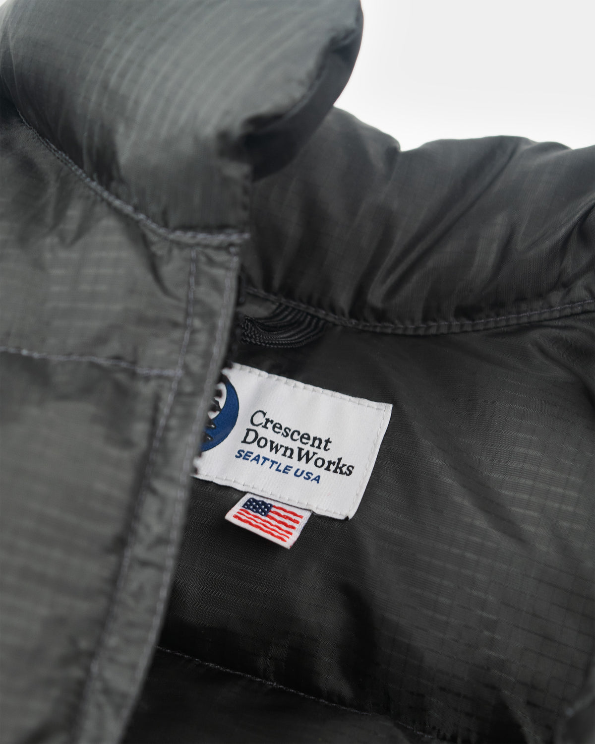 Charcoal north by northwest vest in ripstop nylon with crescent downworks seattle usa label and american flag tag