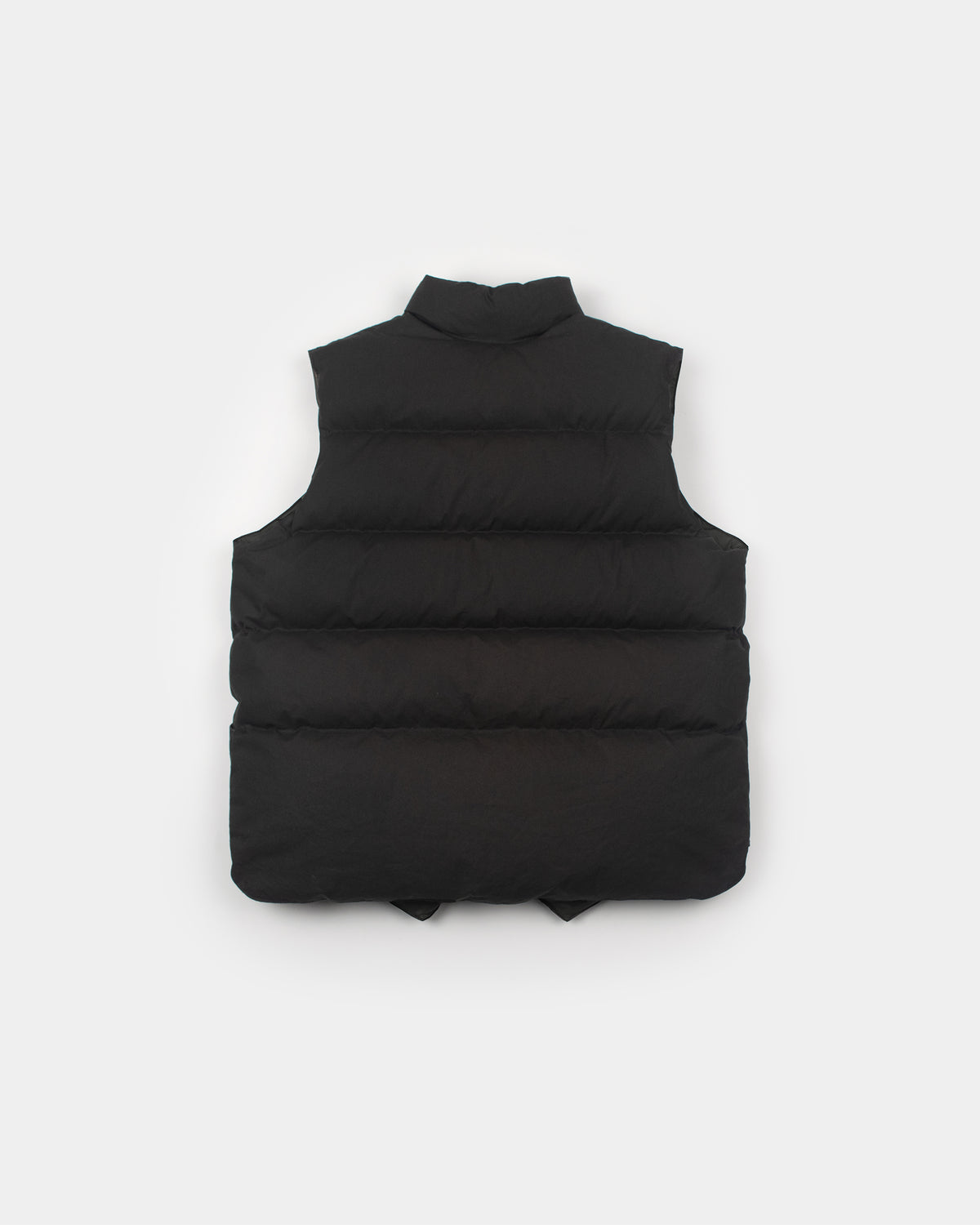 Black north by northwest puffer vest with high collar and horizontal stitching made from dry wax cotton