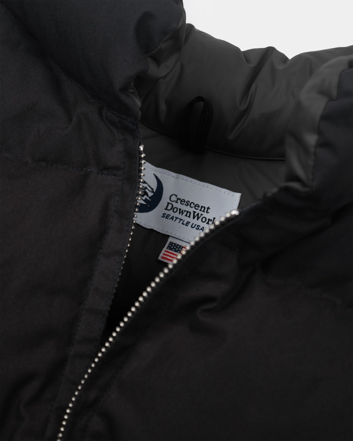 Black north by northwest vest in dry wax cotton with silver zipper and white crescent downwork seattle usa label