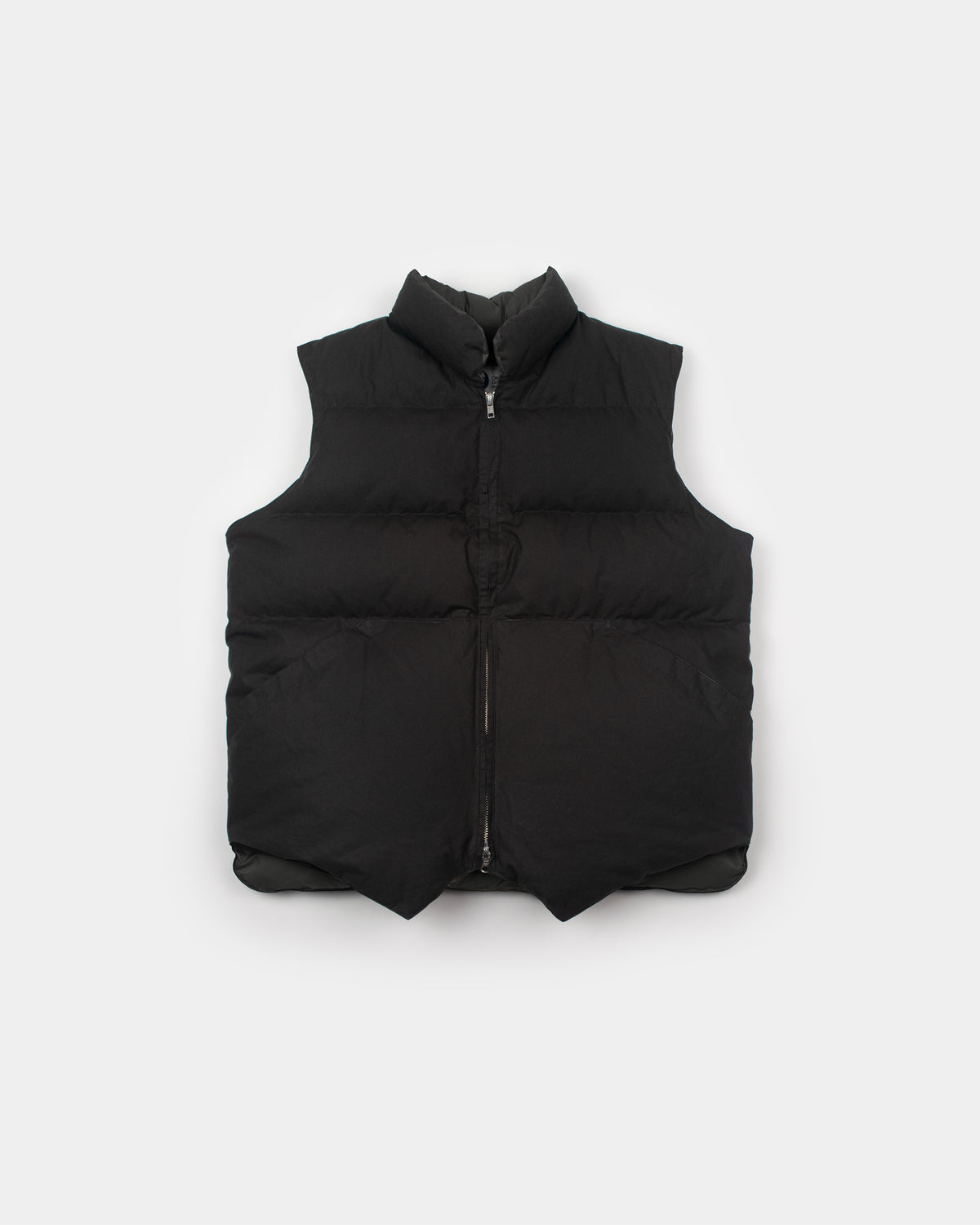 Black north by northwest vest in dry wax cotton with high collar and front zipper for cold weather layering