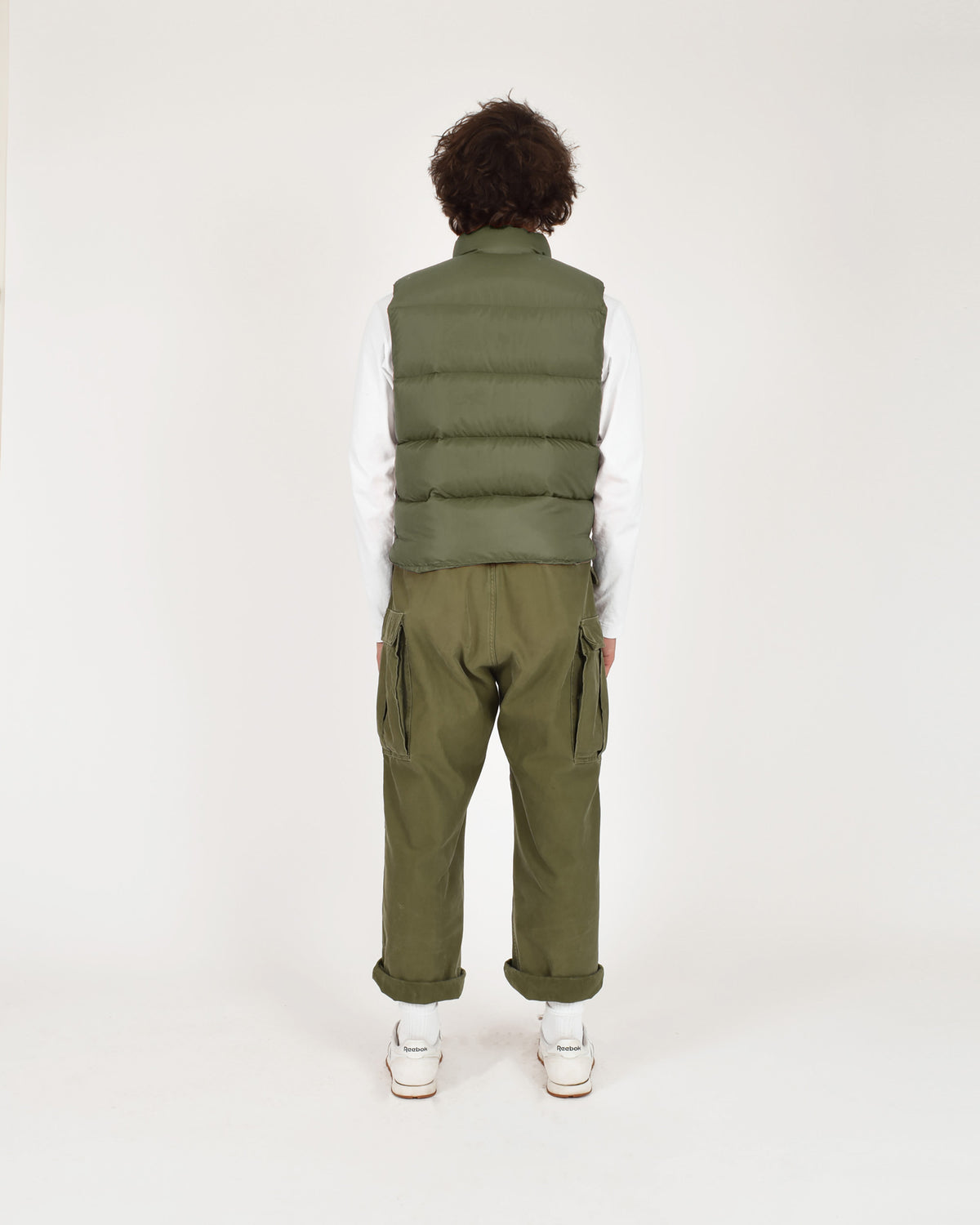 Olive green quilted puffer vest north by northwest made of streakfree nylon for lightweight warmth