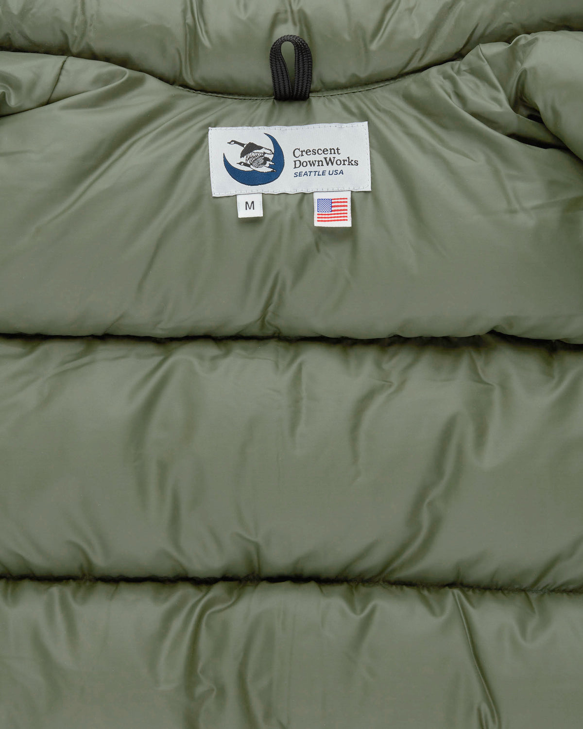 North by Northwest olive quilted puffer vest with high collar and streakfree nylon featuring horizontal stitching
