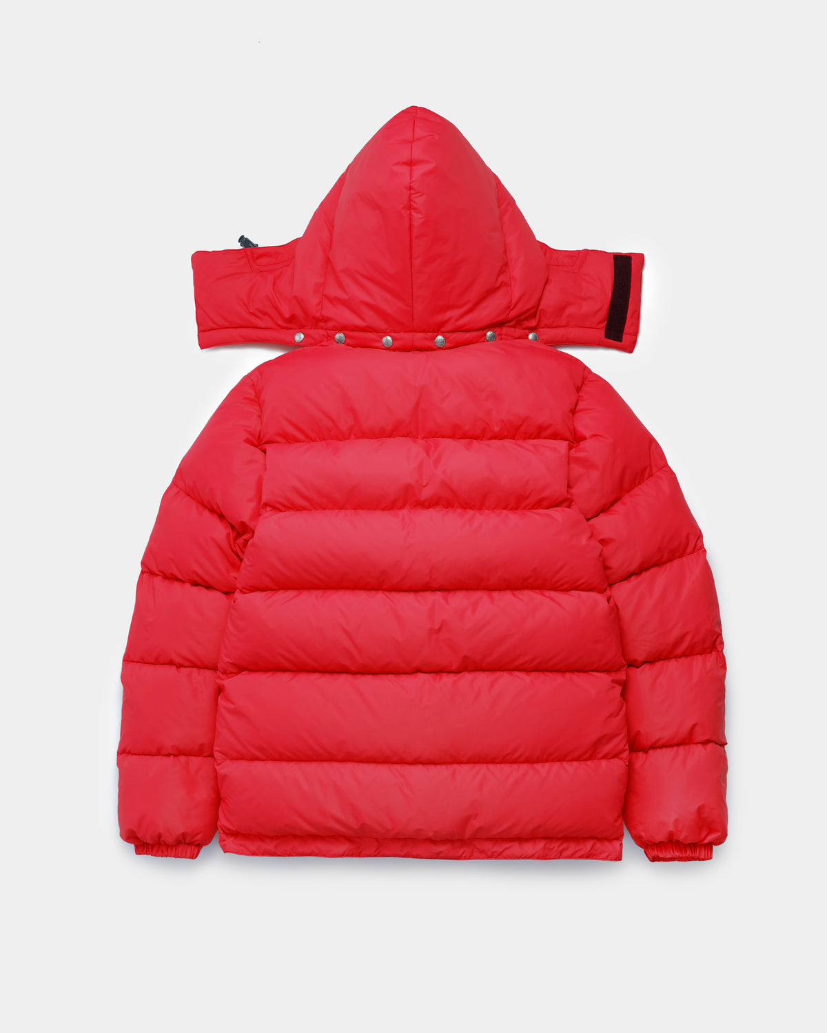 Back view of the Classico Parka in red nylon on a white background.