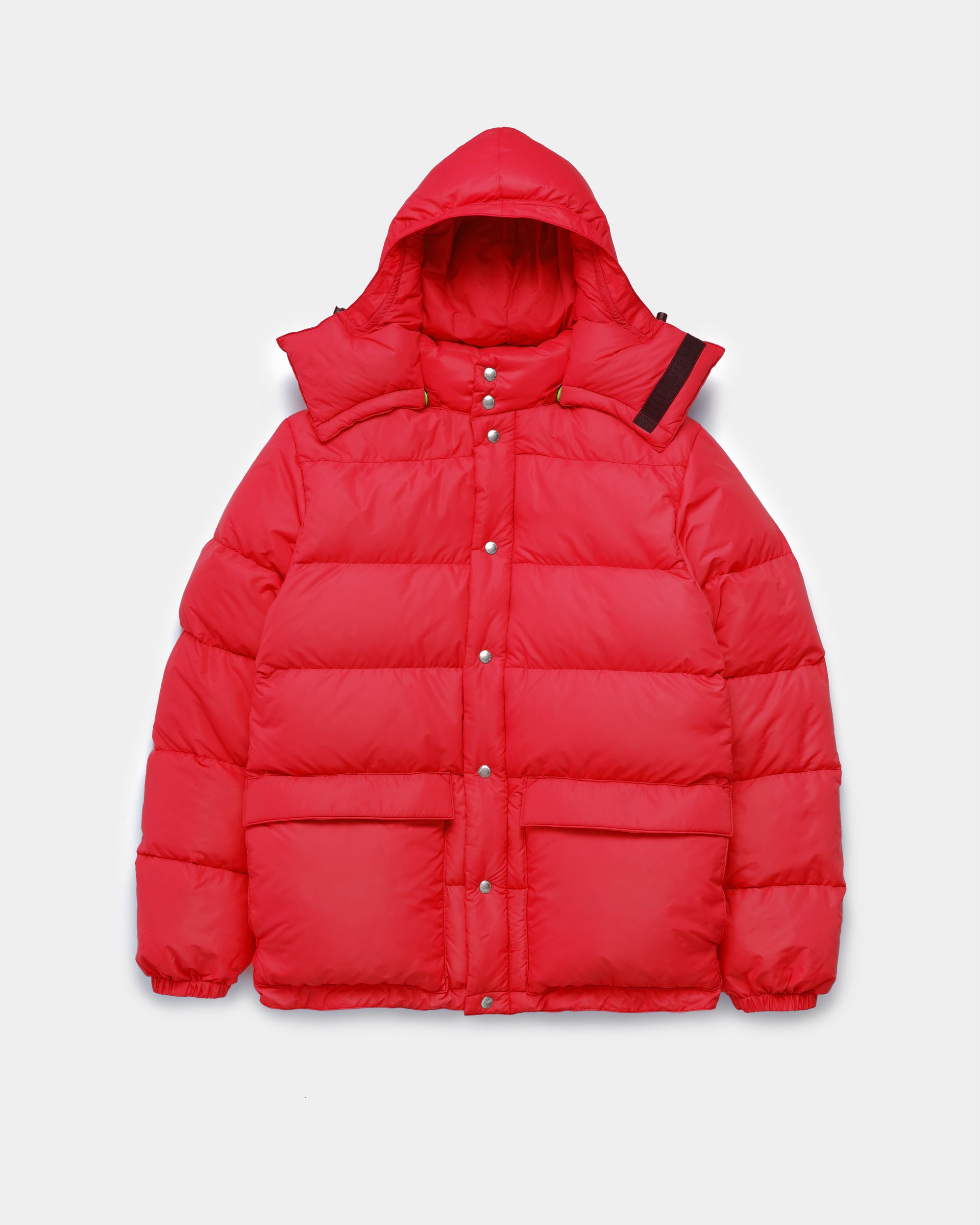 Front view of the Classico Parka in red nylon on a white background.