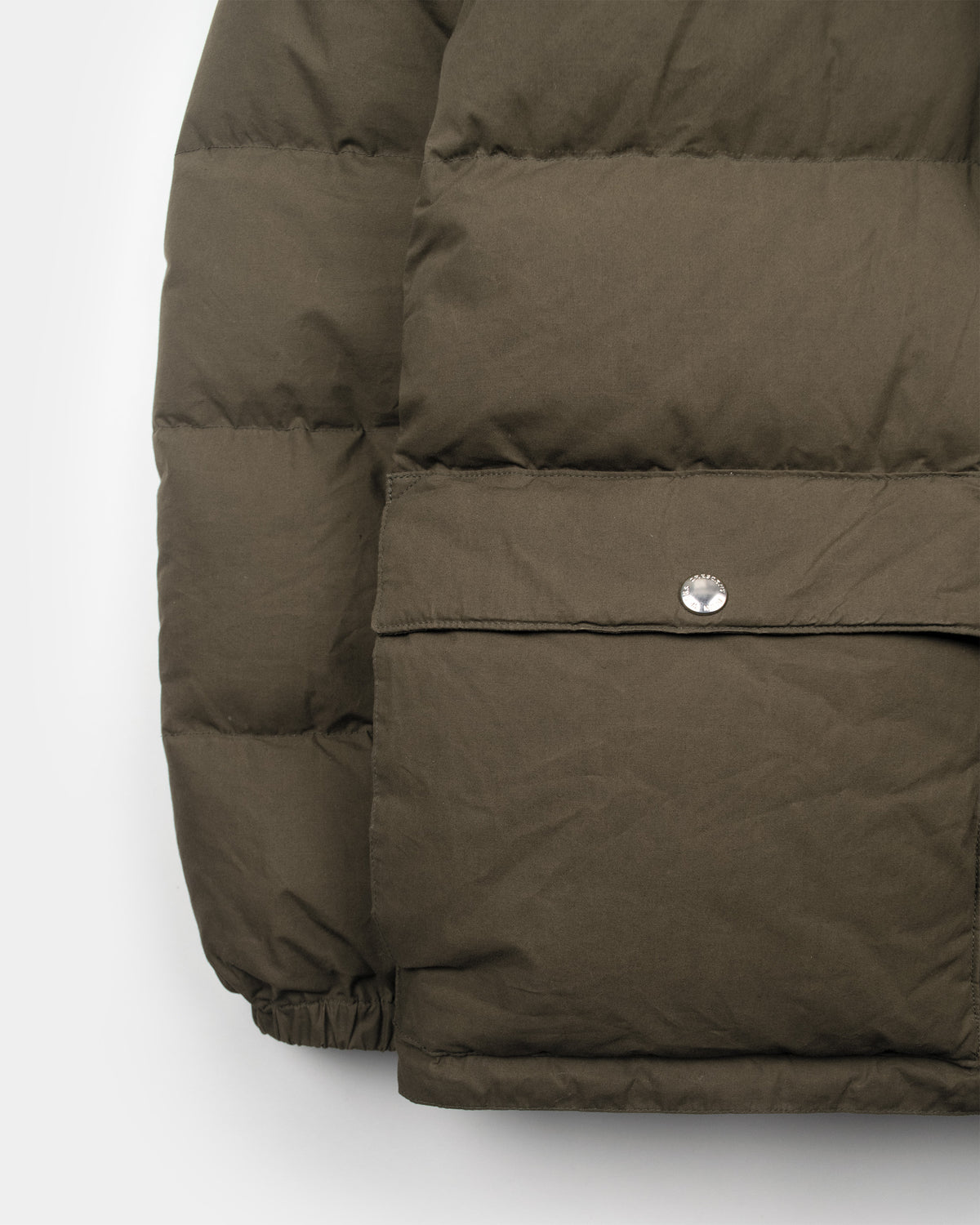 Tent green classico down parka with quilted panels and silver snap button made of dry waxed cotton 
