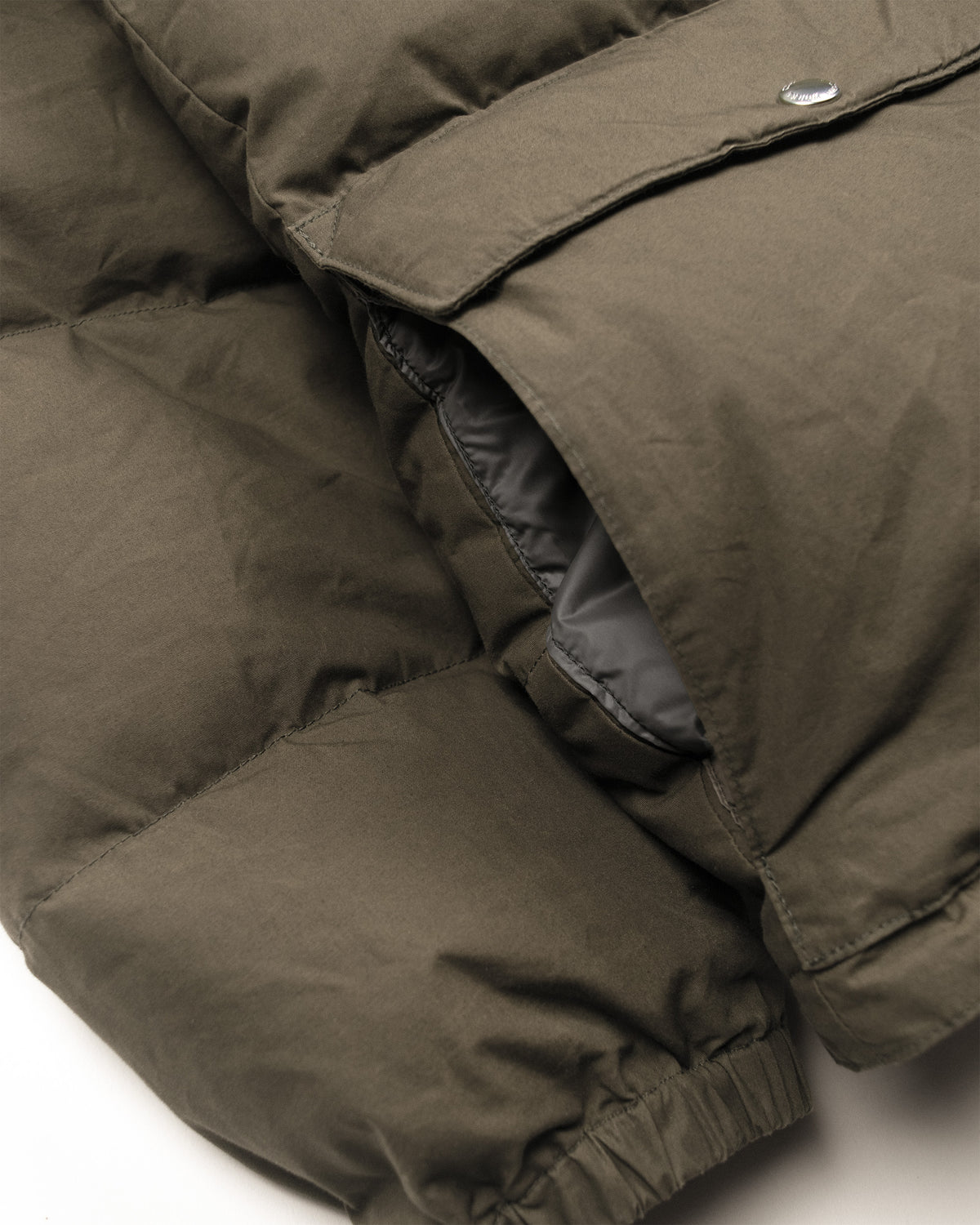 Tent green classico down parka with quilted stitching and silver snap button made from dry waxed cotton