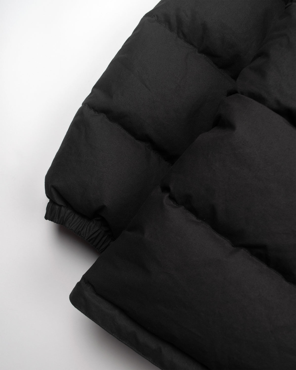 Black classico down parka with quilted stitching elasticated cuffs made from dry waxed cotton