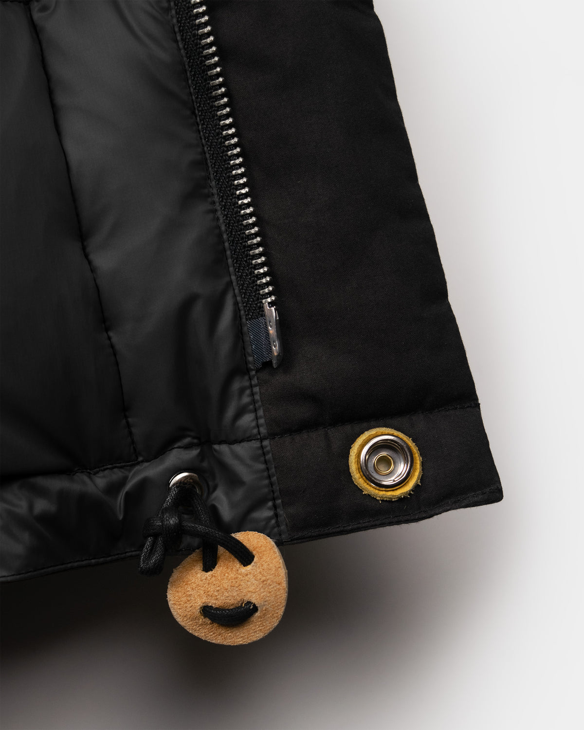 Black classico down parka with zipper and leather toggle made of dry waxed cotton material