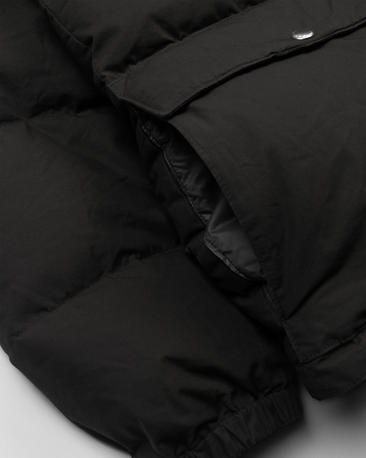 Black classico down parka with quilted stitching silver toned button dry waxed cotton fabric