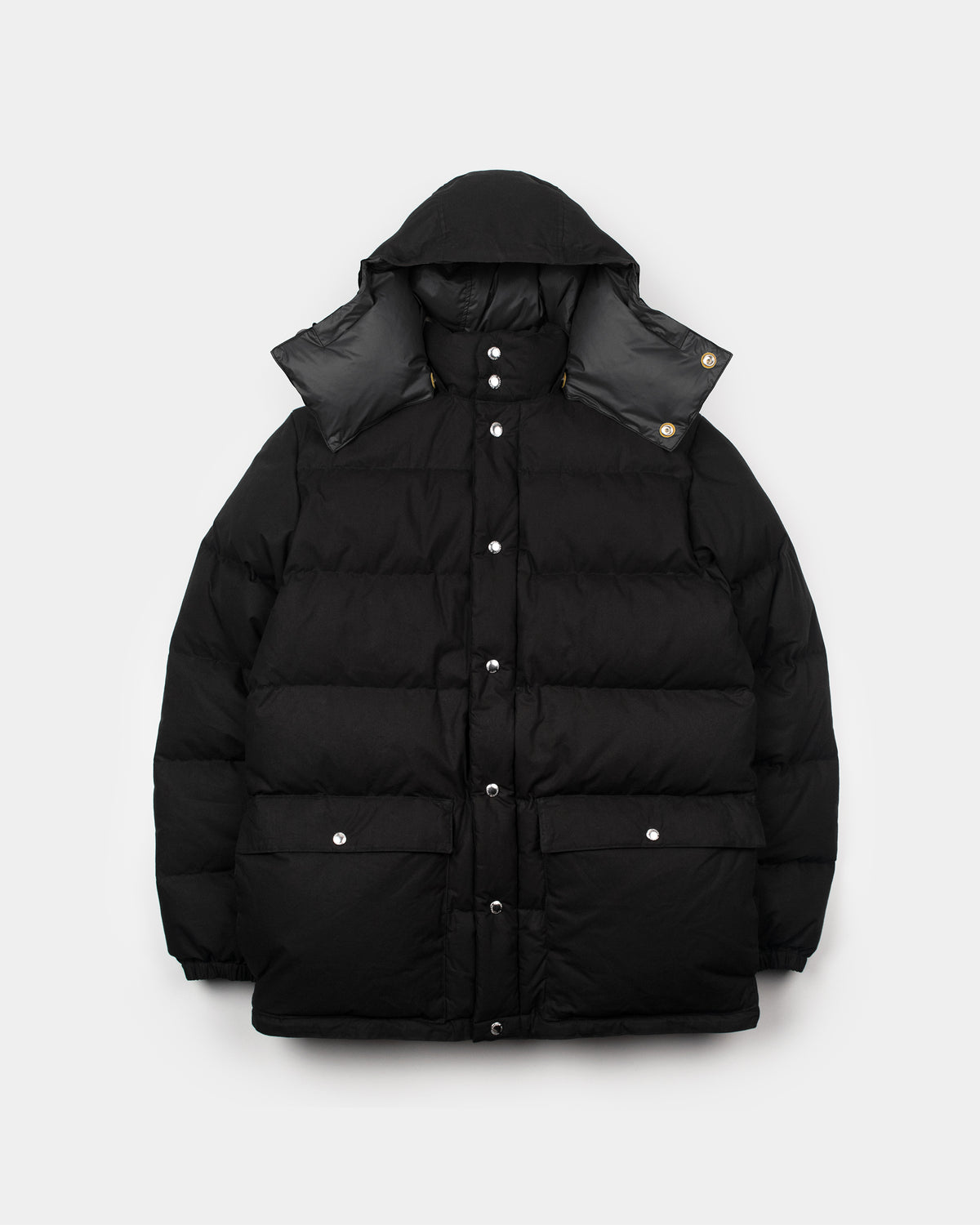 Black classico down parka with hood silver buttons quilted design made from dry waxed cotton