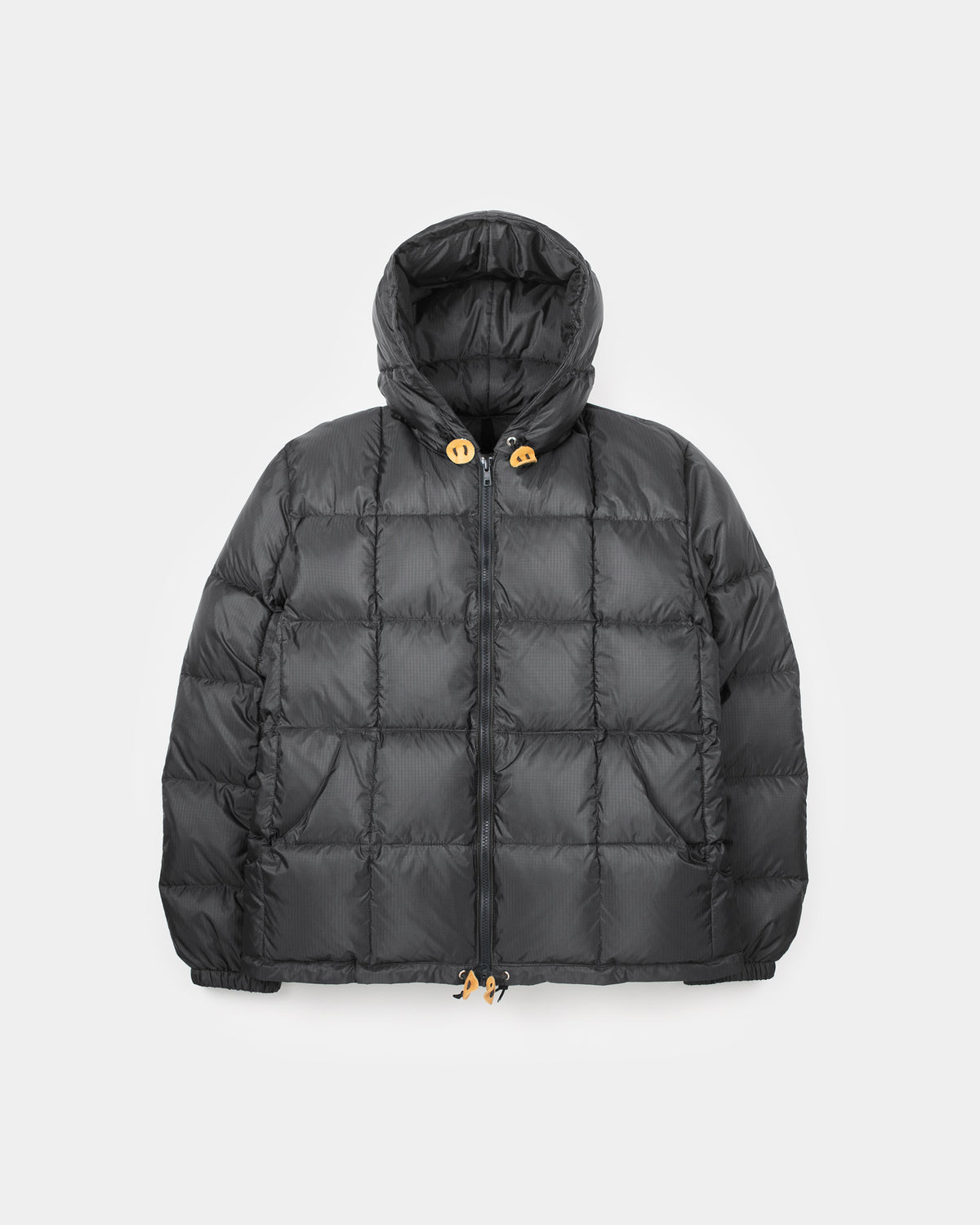 Black quilted puffer jacket with hood tan leather toggle closures and drawstrings made of ripstop nylon 