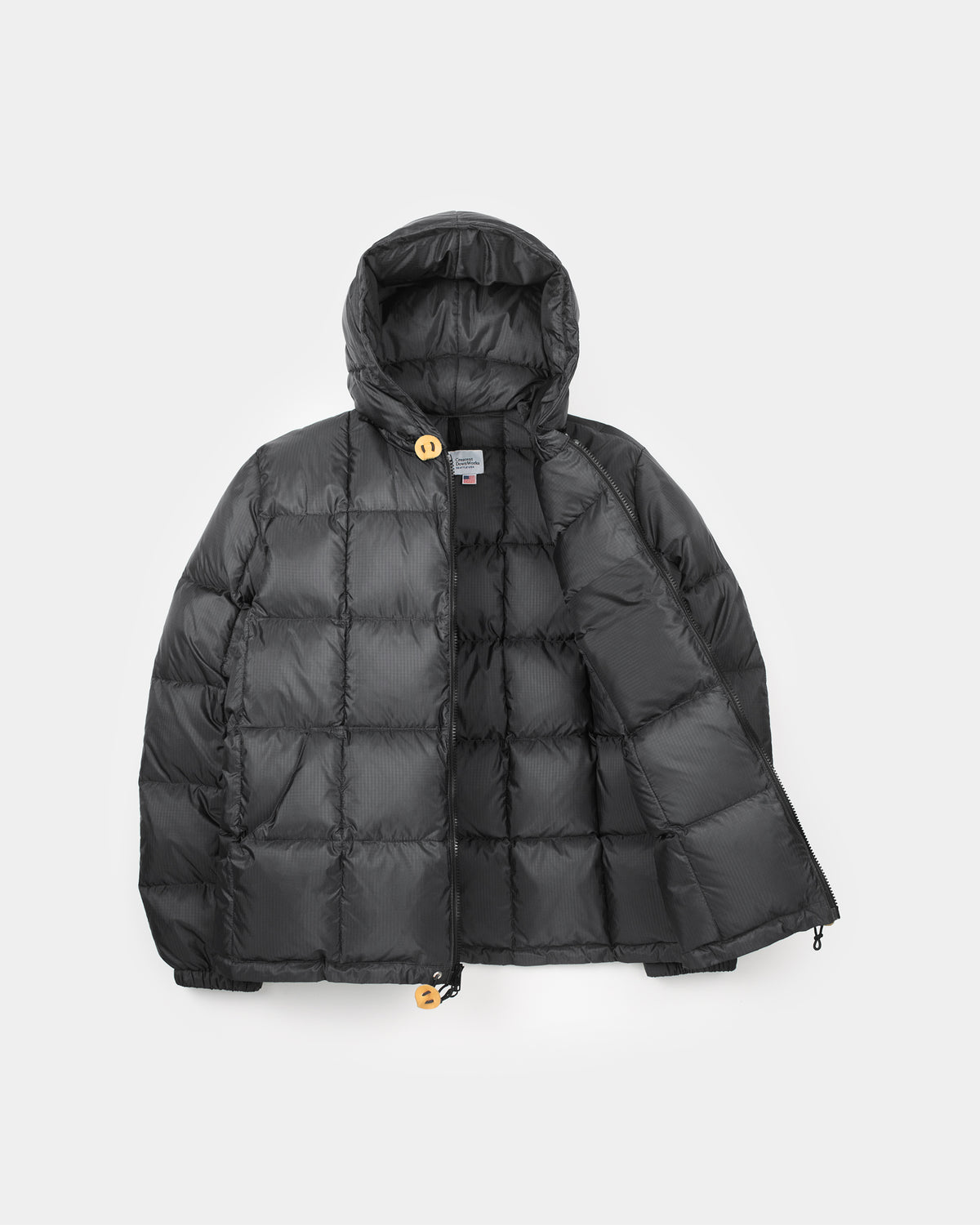 Black puffer jacket with hood quilted design with leather snap reinforcements made of ripstop nylon color