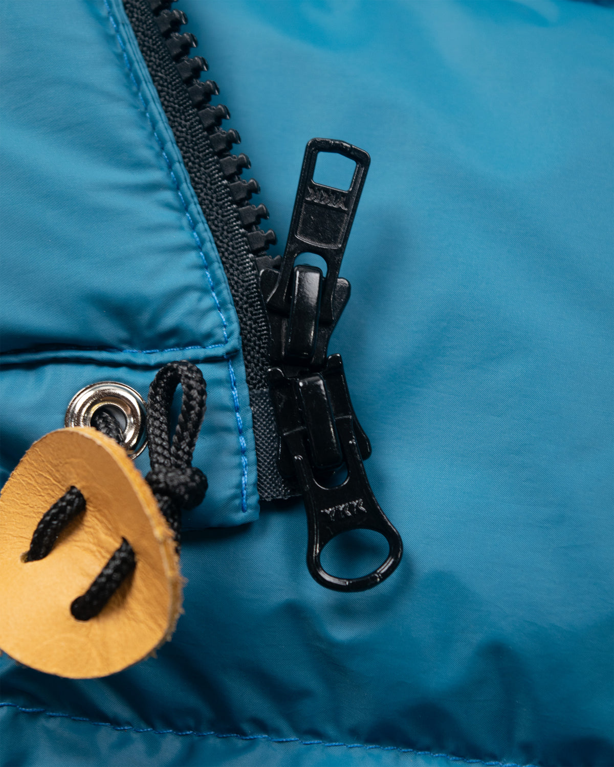 Hooded sweatshirt nylon duck blue with black zipper and leather toggle on the front