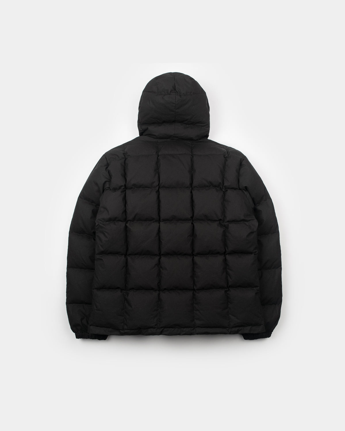 Black quilted puffer jacket with hood made from dry wax cotton shown from the front in a hooded sweatshirt style
