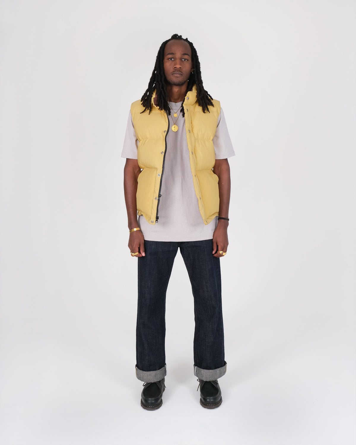 Model wearing the Crescent Down Works &quot;Butter&quot; colorway of the Italian Vest. 