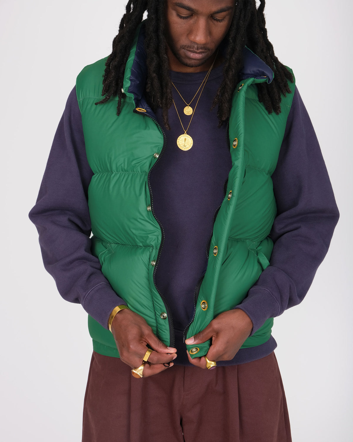 Model wearing the Crescent Down Works &quot;Green&quot; colorway of the Italian Vest. 